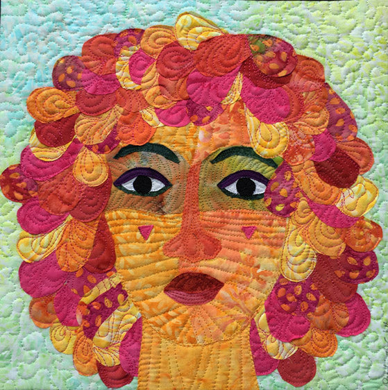 Quilted woman in pink and orange quilt art